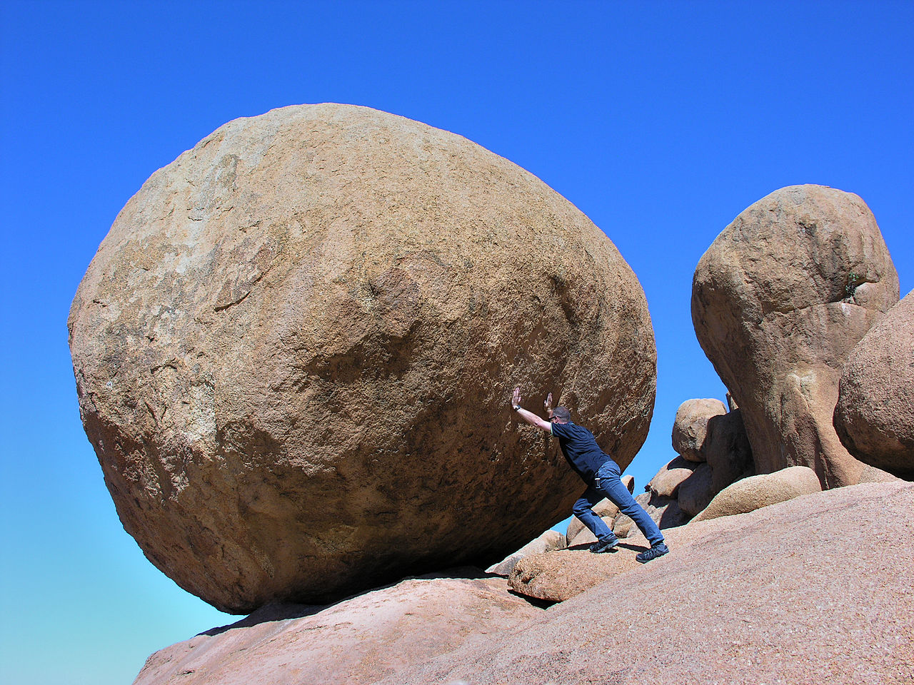 Man pushing a rock: inertia