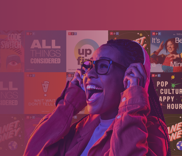 Woman happily listening to music through headphones