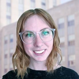 Colleen Leonard pictured outside on buildings