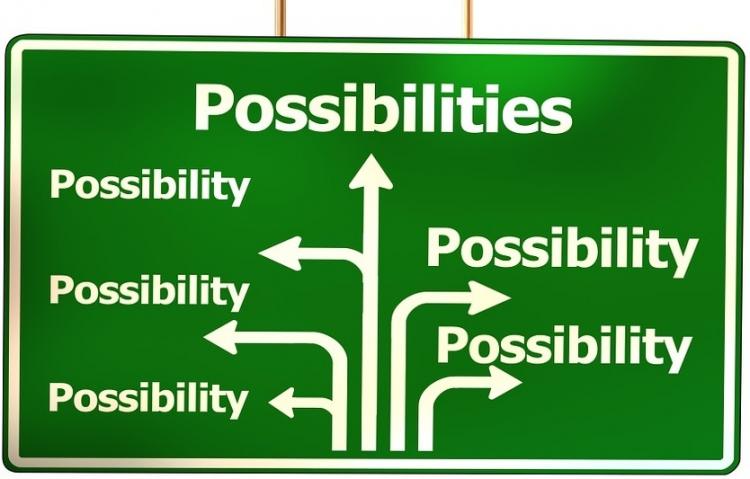 a highway-looking sign with arrows pointing to many possibilities